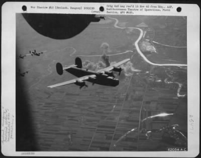 Thumbnail for Szolnok > Bombing Of Railroad Yards At Szolnok, Hungary, By Consoldiated B-24 Liberators Of The 15Th Air Force On 6 Feb 1944.  Four Of The Liberators Shown Leaving The Smoking Target.