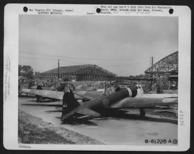 Thumbnail for General > Unstrafed Japanese Airplanes Parked Between Hangars On The West Side Of Atsugi Airdrome, Japan.  5 September 1945.