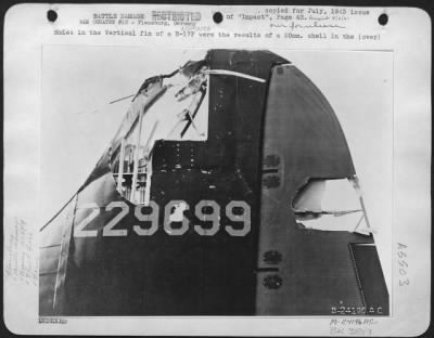 Thumbnail for Battle Damage > Holes in the Vertical fin of a B-17F were the results of a 20mm. Shell in the shipyard attack at Flensburg, May 19.