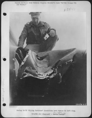 Thumbnail for Battle Damage > Boeing B-17F "Flying ofrtress" incendiary bomb damage to left wing.