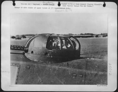 Thumbnail for Battle Damage > Damage to side window of upper turret of (?) Boeing B-17.