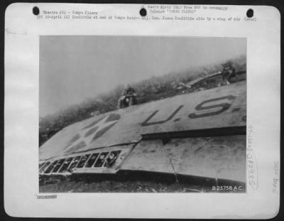 General > Doolittle at end of Tokyo Raid--Maj. Gen. James Doolittle sits by a wing of his crashed plane somewhere in China after he lead the daring U.S. Air Raid on Tokyo. Heading for a China Airfield after the raid, several of the planes ran out of gas