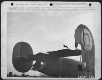 After "dishing it out" in a hectic mission ovre occupied Europe, this Consolidated B-24 "Liberator" Bomber of the US Army 8th AF proved it could "take it" as well by safely returning to its base in Britain in spite of the serious damage to the tail - Page 1