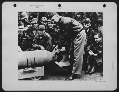 Thumbnail for General > Maj. Gen. (Lt. Col. Then) James H. (Jimmy) Doolittle, U.S.A. wires a Japanese medal to the fin of a 500 lb. bomb which shortly thereafter was returned to its Nipponese makers in a blast of destruction. The ceremony took place on the deck