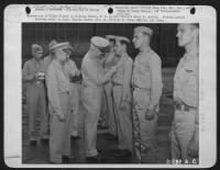 Decoration of Tokyo Fliers at Bolling Field, D.C. by Lt. General Henry H. Arnold. General Arnold pinning medal on Capt. Travis Hoover with Lt. William M. Bower waiting his turn. - Page 2