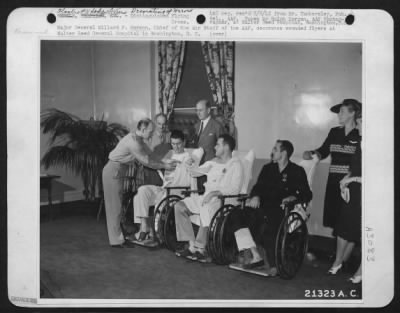 Thumbnail for Ceremonies & Decorations > Major General Millard F. Harmon, Chief of the Air Staff of the Army Air forces, decorates wounded flyers at Walter Reed General Hospital in Washington, D.C. Left to right, General Harmon, Brig. Gen. James H. Doolittle, 1st Lt. Charles L. McClure