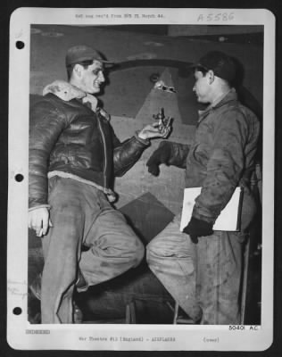 Thumbnail for Battle Damage > S/Sgt Guy T. Hiatt, Covington, Ky. Left waist gunner on "Idiot's Delight" flying his 21st mission, was saved from serious injury when a piece of flak over Berlin hit the ammunition belt of his gun. One 50 cal bullet was exploded and another badly