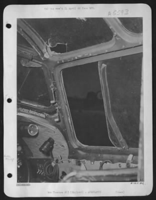 Thumbnail for Battle Damage > View of co-pilot's compartment showing shattered glass in panel over head, where a burst of flak pierced the ship during raid over Frankfurt on 20 March 44. The co-pilot suffered serious head injuries and was rushed to hospital uponn return.