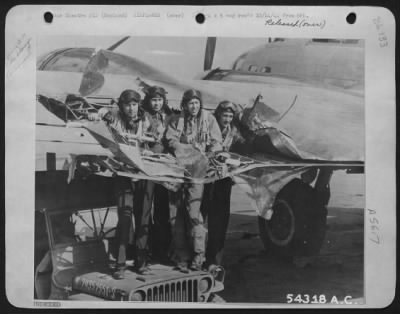 Battle Damage > ENGLAND-When crewmen on this 8th Air force Boeing B-17 Flying ofrtress, returning from an attack on the chemical plant at Ludwigshaven, told intelligence officers that flak had made a hole in the plane's wing big enough for four men to stand in, they