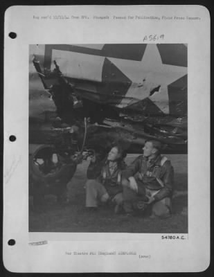 Battle Damage > ENGLAND-When German flak cut control cables, smashed ball-turret and wounded two gunners, 1st Lt. Paul R. McDowell, (right) of Red Cloud and Boelus, Neb., pilot of "Little Miss Mischief" flew the B-17 Flying ofrtress by visual signals to his engineer