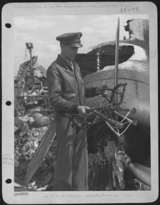 Thumbnail for Battle Damage > Capt. Alvin D. Skaggs Of Lawton, Oklahoma, Ponders His Luck As He Holds Charred Remnant Of His Pilot'S Seat From The Smoldering Wreck Of His Ship, The Consolidated B-24 Liberator 'Vadie Raye'.  The Lib Was Set Afire By Enemy Fighter Attacks After The Assa