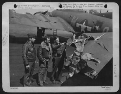 Thumbnail for Battle Damage > The Three Airmen Who All Alone Brought The 8Th Air Force Boeing B-17 "Flying Fortress" 'Reluctant Dragon' Home From A Bombing Attack On War Plants In Berlin, After Six Of The Crew Bailed Out And The Remaining Man Was Killed At His Guns, Survey The Jagged