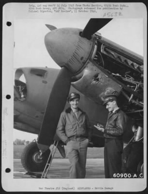 Thumbnail for Battle Damage > Lt. Tunnel And Lt. Mccarthy Of The 654Th Bomb Squadron, 25Th Bomb Group, Standing Beside A Flak Damaged De Haviland "Mosquito" Reconnaissance.  England, 4 August 1944.