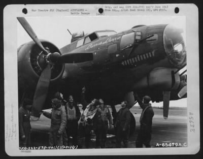 Battle Damage > Crew Member Examines Battle Damage To Their Boeing B-17 "Flying Fortress" 'Bonnie Donnie' Of The 401St Bomb Group Which Participated In A Bombing Mission Over Frankfurt, Germany, 29 January 1944.