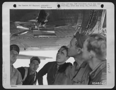 Battle Damage > Crew Members Examine Damage To A Boeing B-17 "Flying Fortress" Of The 401St Bomb Group Which Participated In A Bombing Mission Over Gaggenau, Germany, 13 December 1944.