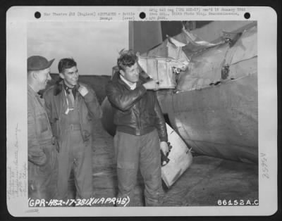 Battle Damage > Crew Chief M/Sgt. Gerberding, Lt. Horn And Lt. Brashere Examine Tail Section Of Boeing B-17 "Flying Fortress" (Aircraft No. 46883), 381St Bomb Group, With Stabilizer Completely Shot Away.  England, 11 April 1945.