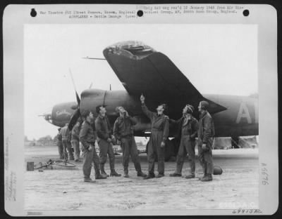 Battle Damage > Crew Members Of A Martin B-26 'Bomb Boogie' Look Over The Damage Done To Their Plane By Flak During A Mission Over Enemy Territory On 7 September 1943.  They Are Attached To The 386Th Bomb Group Based At Great Dunmow, Essex, England.