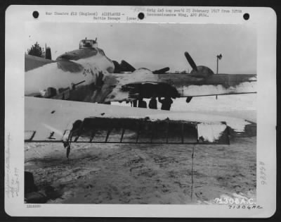 Battle Damage > Men Of The 379Th Bomb Group Examine The Wing Of A Boeing B-17 (A/C No. 633) Which Was Damaged During A Mission Over Enemy Territory On 29 January 1945.  Note Damage To Elevator Of The Tail.  England.