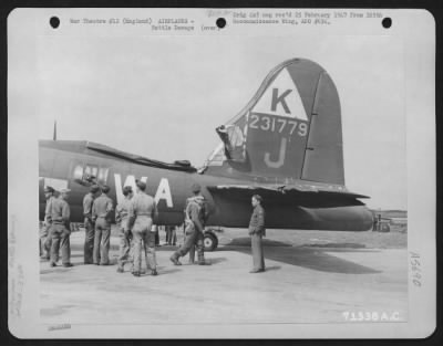 Battle Damage > Mission Of The 379Th Bomb Group Inspect A Boeing B-17 "Flying Fortress" Which Was Damaged During A Mission Over Enemy Territory On 24 May 1944.  England.