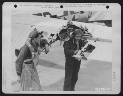 Thumbnail for Battle Damage > Two Crew Members Of The 379Th Bomb Group Inspect The Tail Section Of A Boeing B-17 Which Was Damaged During A Mission Over Enemy Territory On 20 April 1944.  England.