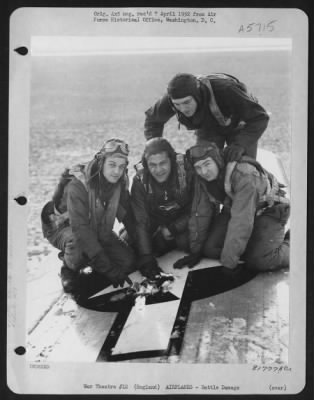 Thumbnail for Battle Damage > Crew Members Of The 458Th Bomb Group Point Out The Battle Damage Done To Their Consolidated B-24.  1 January 1945.