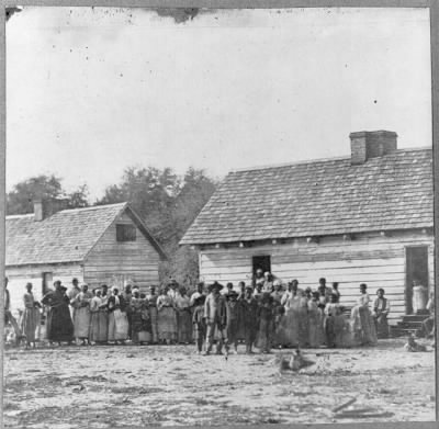 Thumbnail for 1150 - Large group of slaves(?) standing in front of buildings on Smith's Plantation, Beaufort, South Carolina