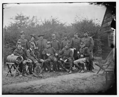 Thumbnail for 1477 - Cumberland Landing, Virginia. Seated: Generals, Andrew A. Humphreys, Henry Slocum, Wm B. Franklin, Wm F. Barry and John Newton. Officers standing not indentified