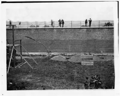 Thumbnail for 1923 - Washington, D.C. Coffins and open graves ready for the conspirators' bodies at right of scaffold