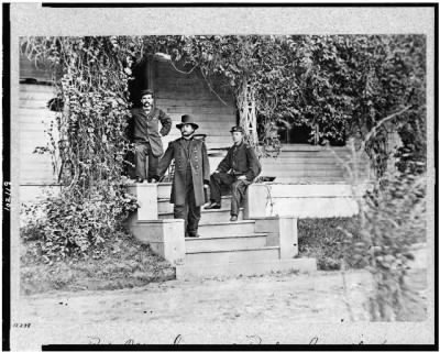 2058 - Bv't. Maj. General Rufus Ingalls, full-length portrait, standing on steps, facing left, with two other soldiers