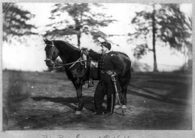 Thumbnail for 2432 - O.H. Hart, full-length portrait, standing, left profile, in uniform, alongside horse