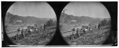 2913 - Jericho Mills, Va. Party of the 50th New York Engineers building a road on the south bank of the North Anna, with a general headquarters wagon train crossing the pontoon bridge