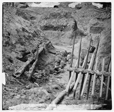 Thumbnail for 3997 - Petersburg, Va. Dead Confederate soldier, in trench beyond a section of chevaux-de-frise