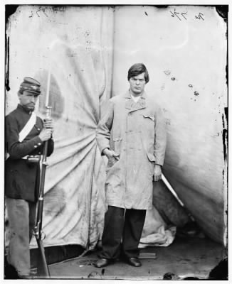 Thumbnail for 5128 - Washington Navy Yard, District of Columbia. Lewis Payne, standing in overcoat and without hat. Federal guard standing on left