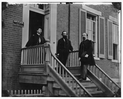 Thumbnail for 5607 - Washington, D.C. Col. Benjamin F. Fisher between two officers on steps of Signal Corps headquarters, 1816 F St., NW Avenue at Madison Place NW