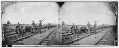 643 - Manassas Junction, Va. Soldiers beside damaged rolling stock of the Orange & Alexandria Railroad