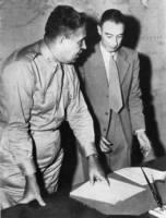 General Leslie Groves (left) with Professor Robert Oppenheimer