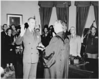 Thumbnail for 744px-Photograph_of_Dean_Acheson_taking_the_oath_of_office_as_Secretary_of_State_in_the_Oval_Office,_with_Chief_Justice..._-_NARA_-_200076.jpg