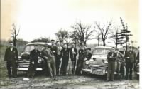 Disabled Vets with new cars, Dad is 5th from right, arms crossed.jpg