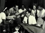 Thumbnail for Sister Rosetta Tharpe on the left, Duke Ellington pretending to play Rosetta's resophonic guitar, and Cab Calloway at the piano..jpg