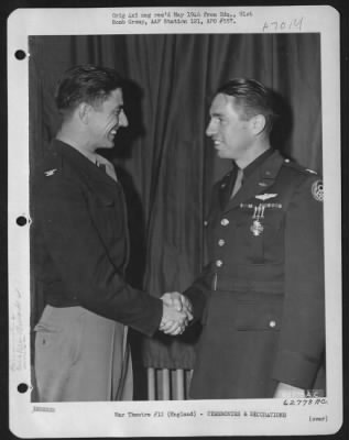 Thumbnail for Awards > Colonel Terry, Group Commanding Officer, Congratulates Capt. Hudson After Presenting Him With The Distinguished Flying Cross.  91St Bomb Group, 8Th Air Force, England.  16 June 1944.