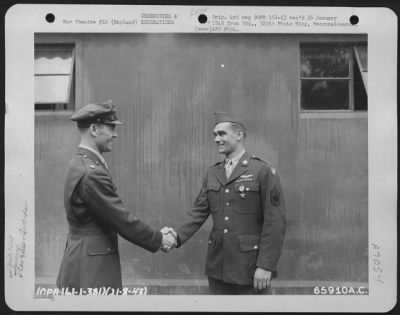 Awards > Colonel J.J. Nazzaro Congratulates T/Sgt. Sinclair Of The 381St Bomb Group After Presenting Him With The Silver Star On 21 August 1943.  England.