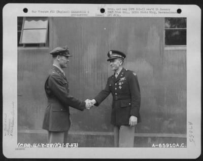 Awards > Colonel J.J. Nazzaro Congratulates Lt. Conley Of The 381St Bomb Group After Presenting Him With The Distinguished Flying Cross On 21 August 1943.  England.