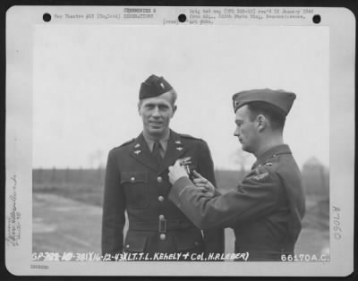 Awards > Colonel Hary P. Leber Presents Lt. T.L. Kehely The Distinguished Flying Cross.  381St Bomb Group, England December 1943.