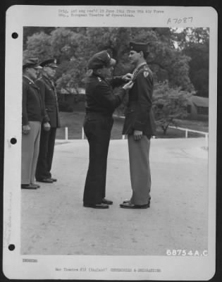 Thumbnail for Awards > Colonel Morton D. Magaffin Is Presented The Distinguished Flying Cross By Lt. General Lewis H. Brereton.  Brig. General Vic H. Strahm And Brig. Gen. Otto P. Weyland Stand In The Background.  31 May 1944, England.