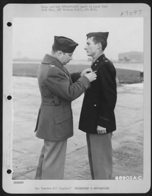 Thumbnail for Awards > Lt. Caton Of The 353Rd Fighter Group Is Presented The Air Medal By Colonel Rimmerman Somewhere In England, 30 December 1944.