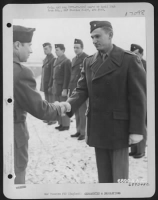 Thumbnail for Awards > Colonel Rimerman Congratulates Lt. Arnold Of The 353Rd Fighter Group After Awarding Him The Air Medal Somewhere In England, 30 December 1944.