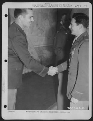 Awards > Colonel Moore, Attached To Hdq., 1St Bomb Division, Is Congratulated By Brig. General Alfred R. Maxwell After Receiving The Distingished Flying Cross During A Ceremony On 28 December 1943 At An 8Th Air Force Base In England.