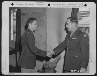 Awards > Colonel Lyle, Attached To Hdq., 1St Bomb Division, Is Congratulated By Brig. General Robert B. Williams During A Ceremony At An 8Th Air Force Base In England On 5 June 1944.