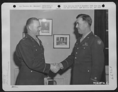 Awards > Colonel Mustoe, Attached To Hdq., 1St Bomb Division, Is Congratulated By Brig. General Howard M. Turner After He Received The Distinguished Flying Cross During A Ceremony At On 3 January 1944 At An 8Th Air Force Base In England.