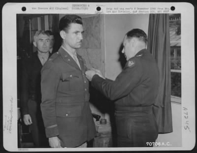 Awards > Colonel Luper, Attached To Hdq., 1St Bomb Division, Is Presented An Award By Major General Robert B. Williams During A Ceremony On 25 June 1944 At An 8Th Air Force Base In England.